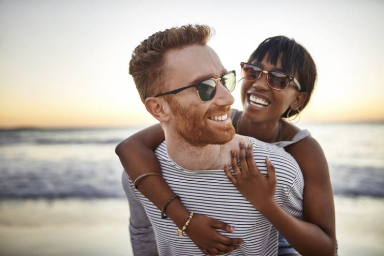 young couple hugging on the beach